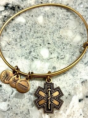 Preowned Alex and Ani gold tone bracelet medical charm